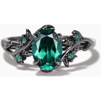 Bague de fiançailles en or noir avec émeraude taille ovale de 1,5 ct