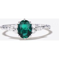 Bague de fiançailles en émeraude verte taille ovale avec design en corde torsadée