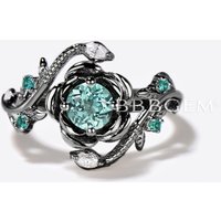 Bague de fiançailles en or blanc avec saphir vert