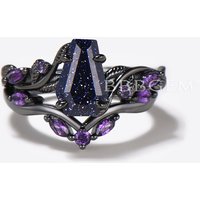 Bague de fiançailles en améthyste et sable bleu en or noir