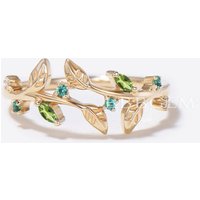 Bague de fiançailles en péridot vert feuille et émeraude