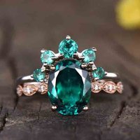 Bague de fiançailles vintage en émeraude et diamant avec bande courbée