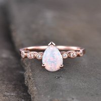 Bague de fiançailles en opale et diamant en or rose