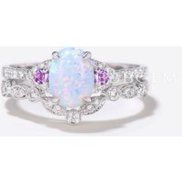 Bague de fiançailles en opale ovale et diamants en or rose