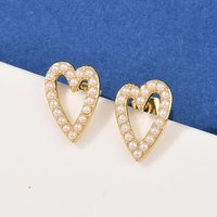 Boucles d'oreilles en forme de cœur creux en laiton, plaquées or 18K — Bijoux fantaisie