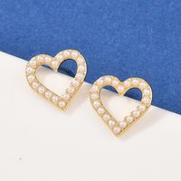 Boucles d'oreilles en forme de cœur creux en laiton - Plaqué or 18K — Bijoux fantaisie