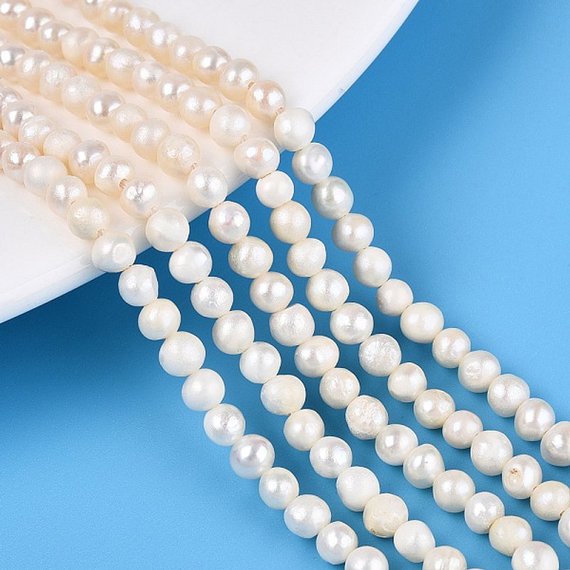 Brins de perles de culture d'eau douce naturelles, blanc crémeux — Perles à bijoux