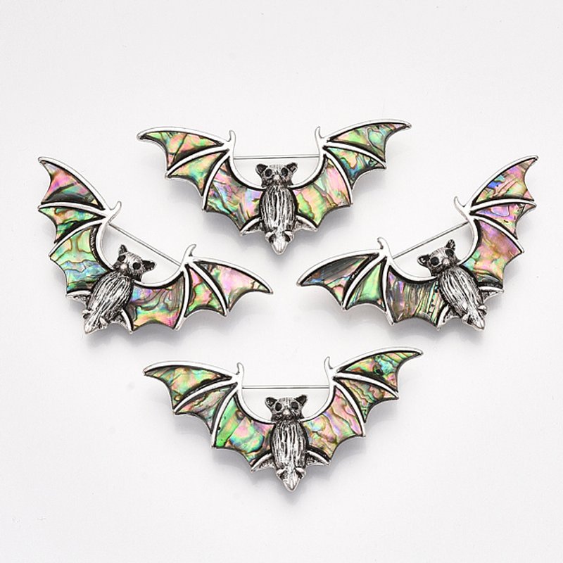 Broche en coquille d'abalone avec chauve-souris en argent antique — Broches