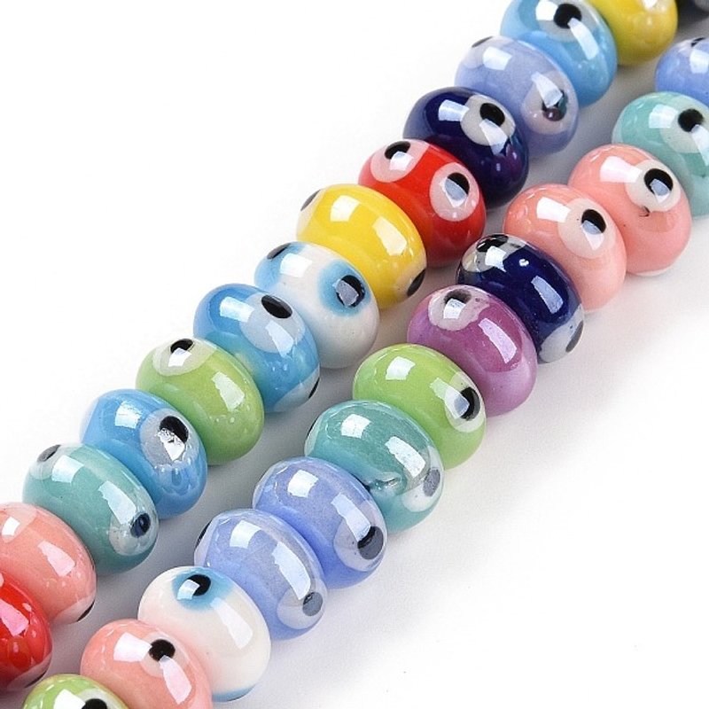 Brins de perles en porcelaine faites à la main avec yeux malins, couleurs variées — Perles à bijoux