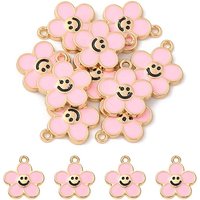 Pendentif en fleur dorée avec visage souriant en rose brumeux