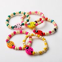 Bracelet en bois extensible pour enfants avec perles coccinelles — Bracelet Femme
