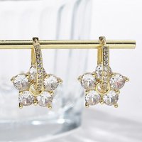 Boucles d'oreilles créoles en zircon cubique clair en forme de fleur