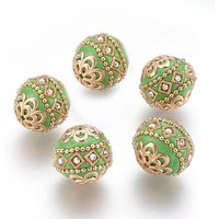 Perles rondes faites à la main d'Indonésie avec éléments métalliques, or clair, vert jaune
