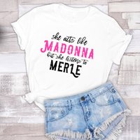She Acts Like Madonna But She Listens To Merle T-shirt