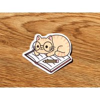 Cute Cat With Glasses Reading A Book Sticker — Autocollants et stickers
