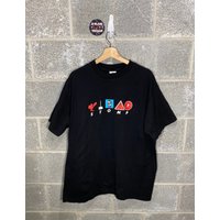 Vintage 1990s Stomp Out Loud Black Graphic Music T-shirt